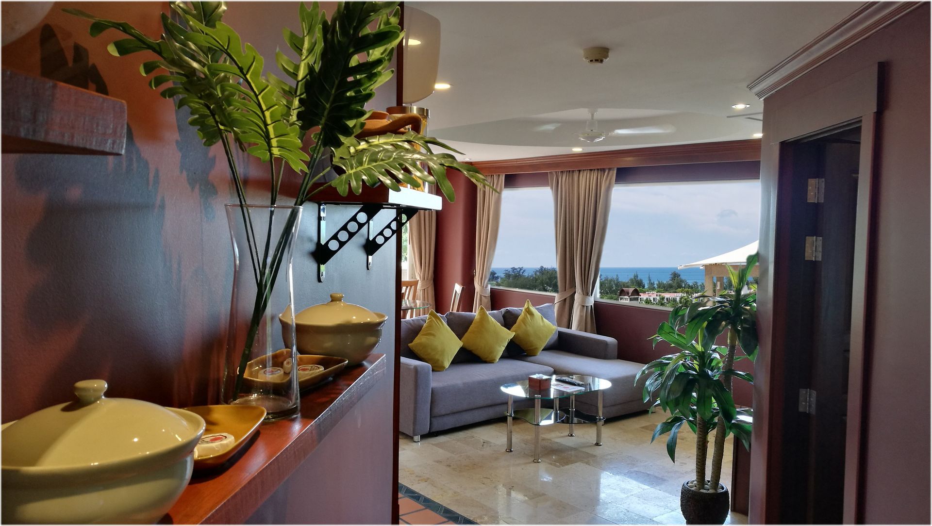 A kitchen with a sink , stove , and a drink on the counter.