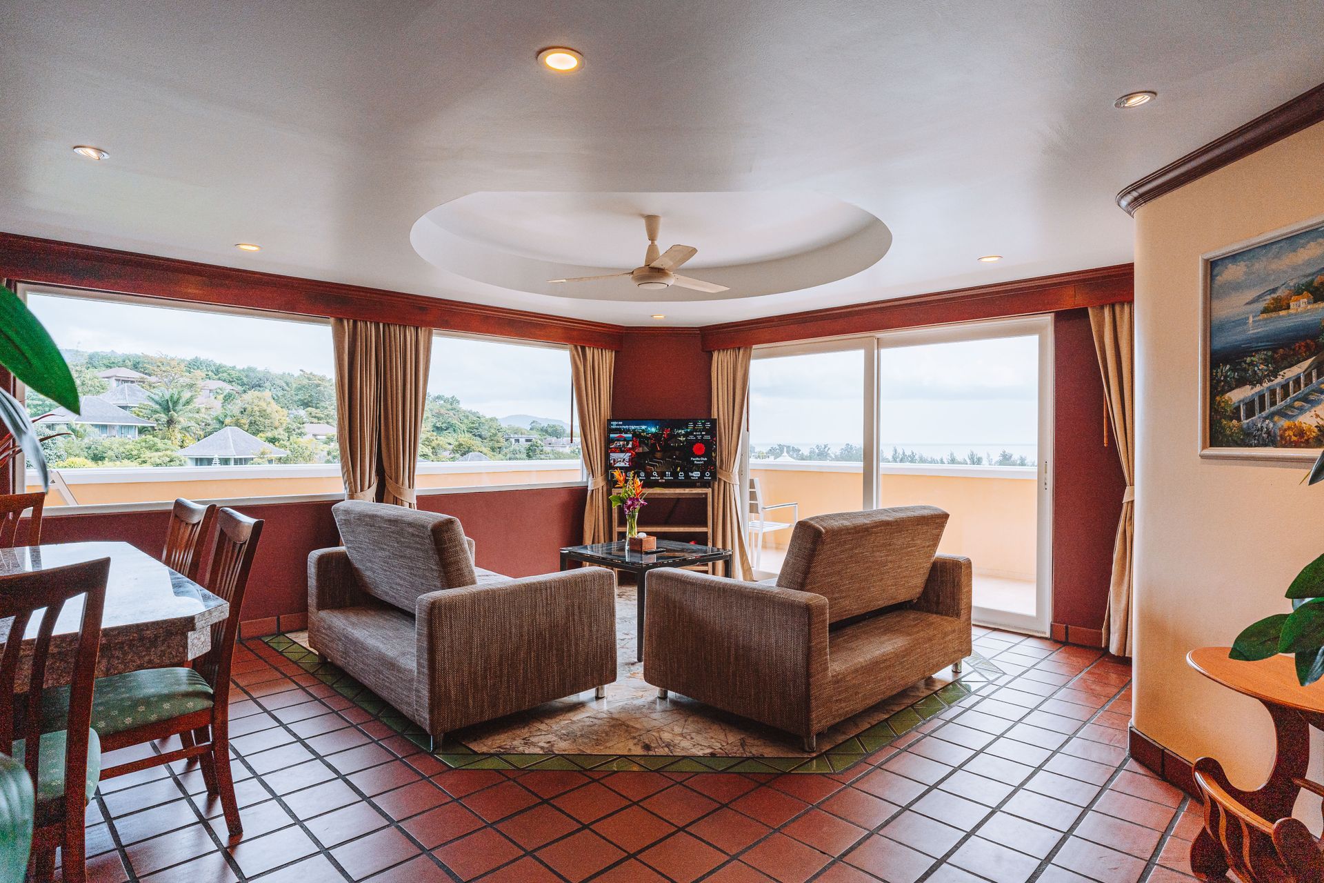 A hotel room with a bunk bed and a king size bed