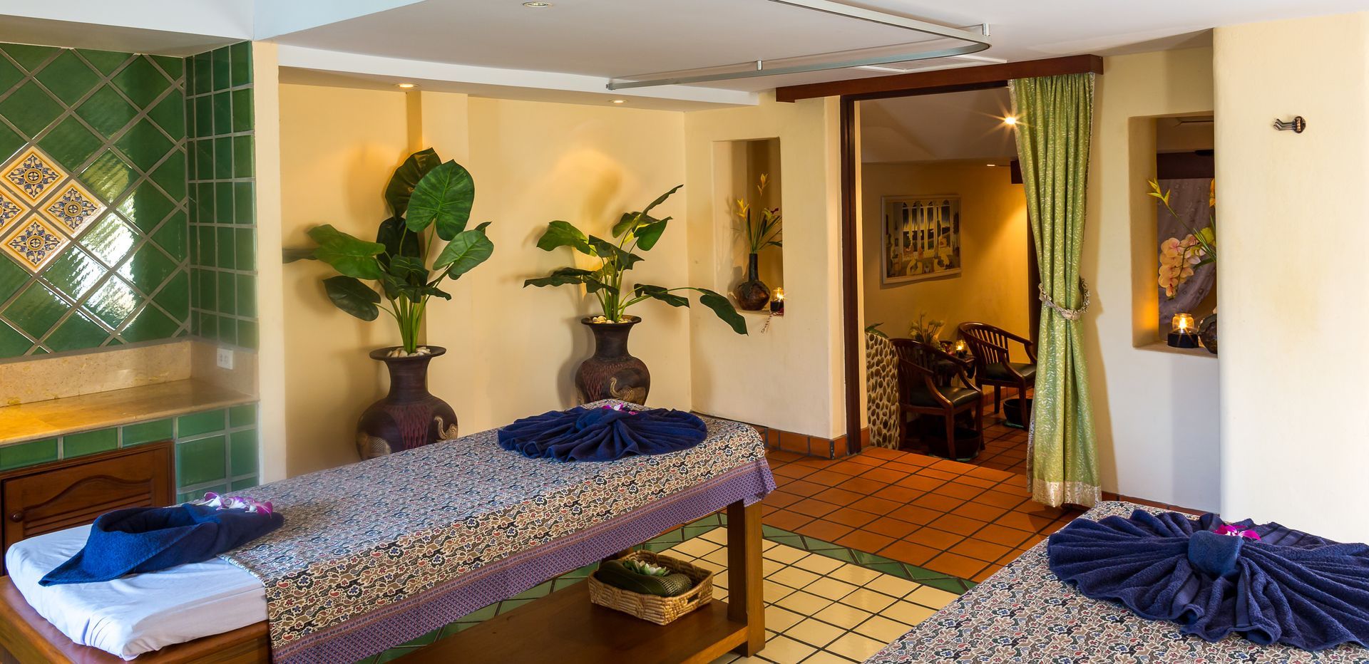There is a massage table in the middle of the room.