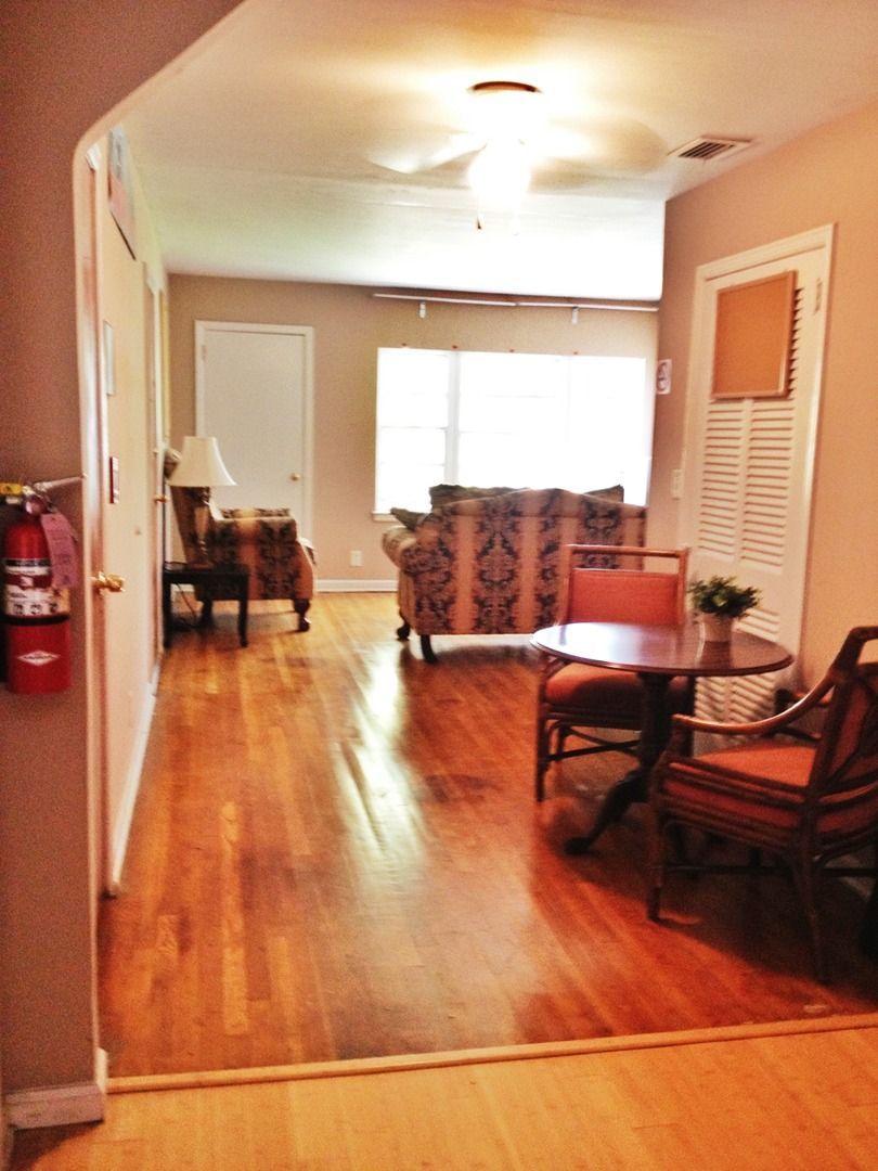 A living room with a fire extinguisher on the wall
