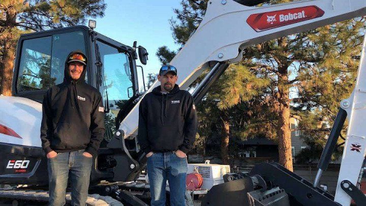 Men in Front of Excavator