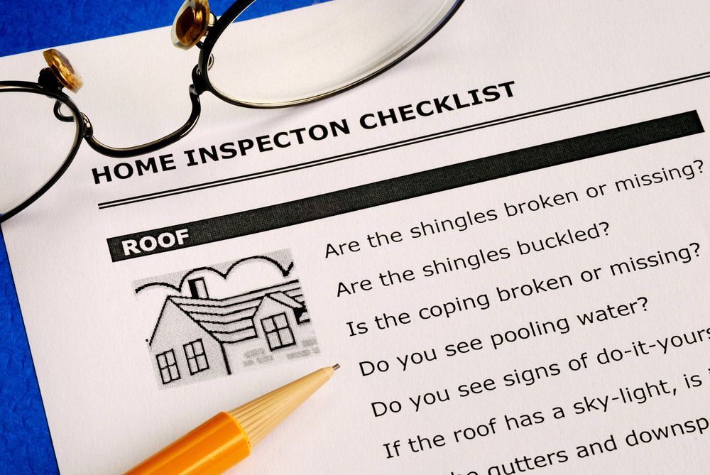A Home Inspection Checklist with Glasses and A Pencil — Hager Surveying In Mullumbimby, NSW