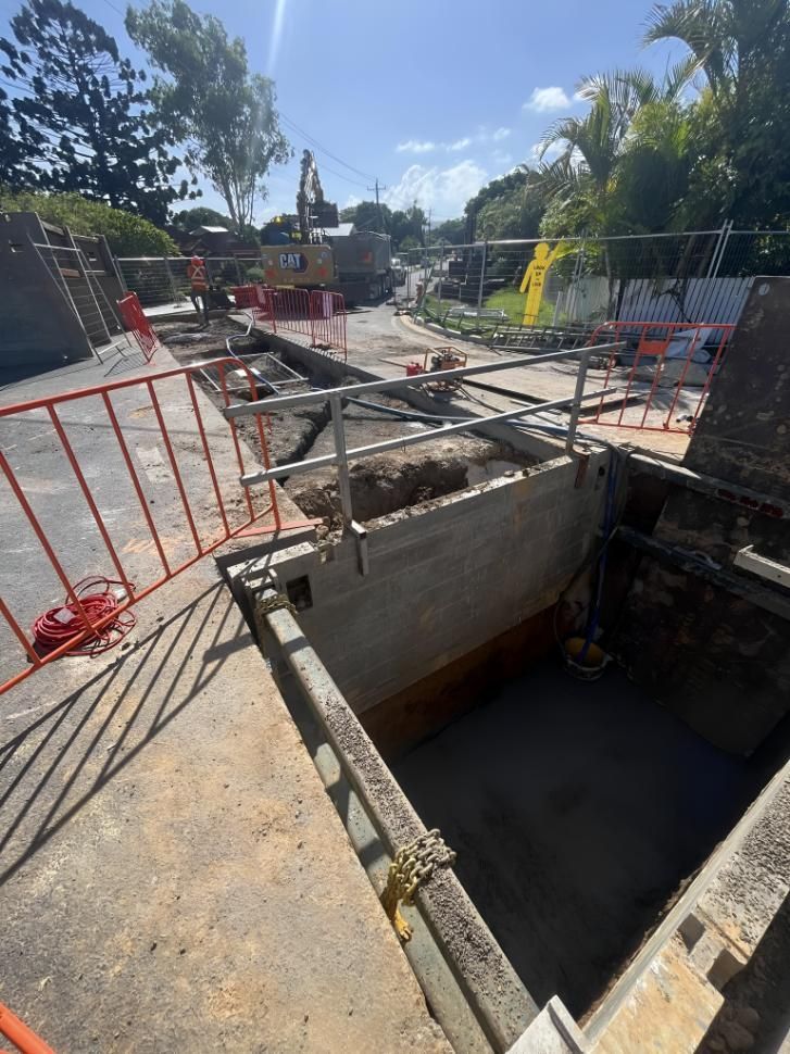 Construction Site With a Fence and a Hole in the Ground — Hager Surveying In Northern Rivers, NSW