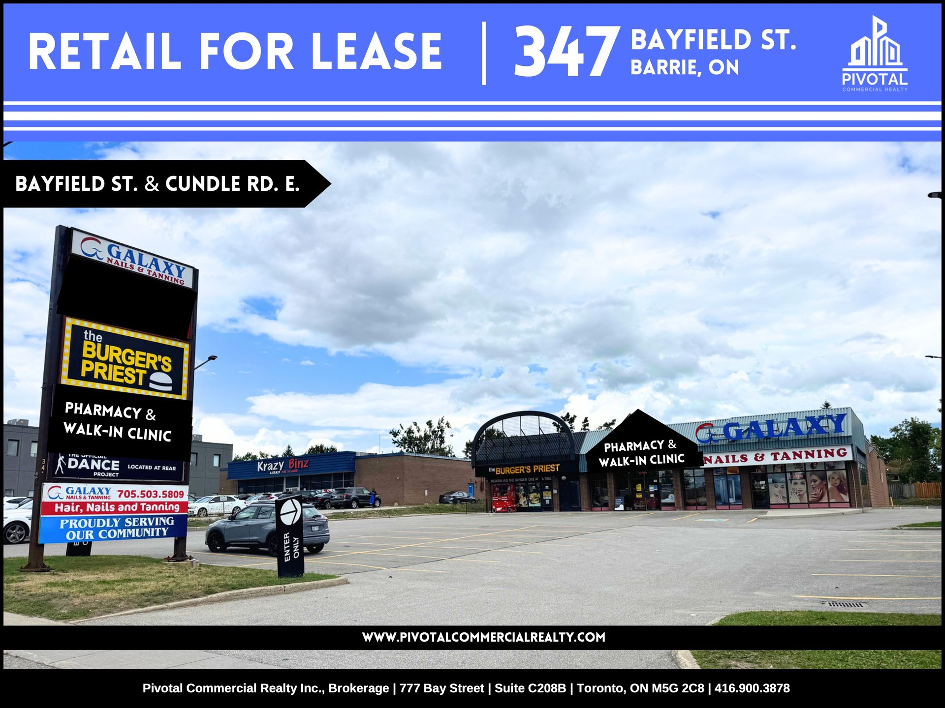 A retail plaza at 347 Bayfield St. in Barrie, Ontario, featuring a storefront sign and parking lot under a cloudy sky.