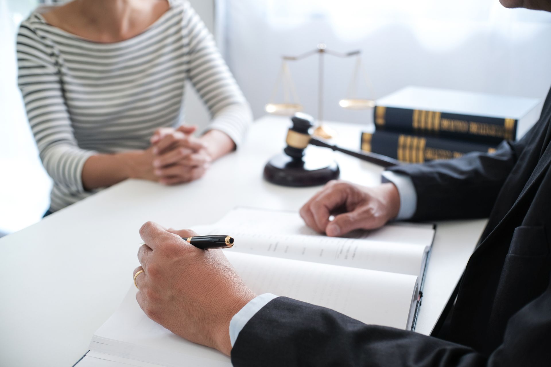 A woman meets with a judge from Gayheart & Willis PC, personal injury lawyers in Orange, VA.