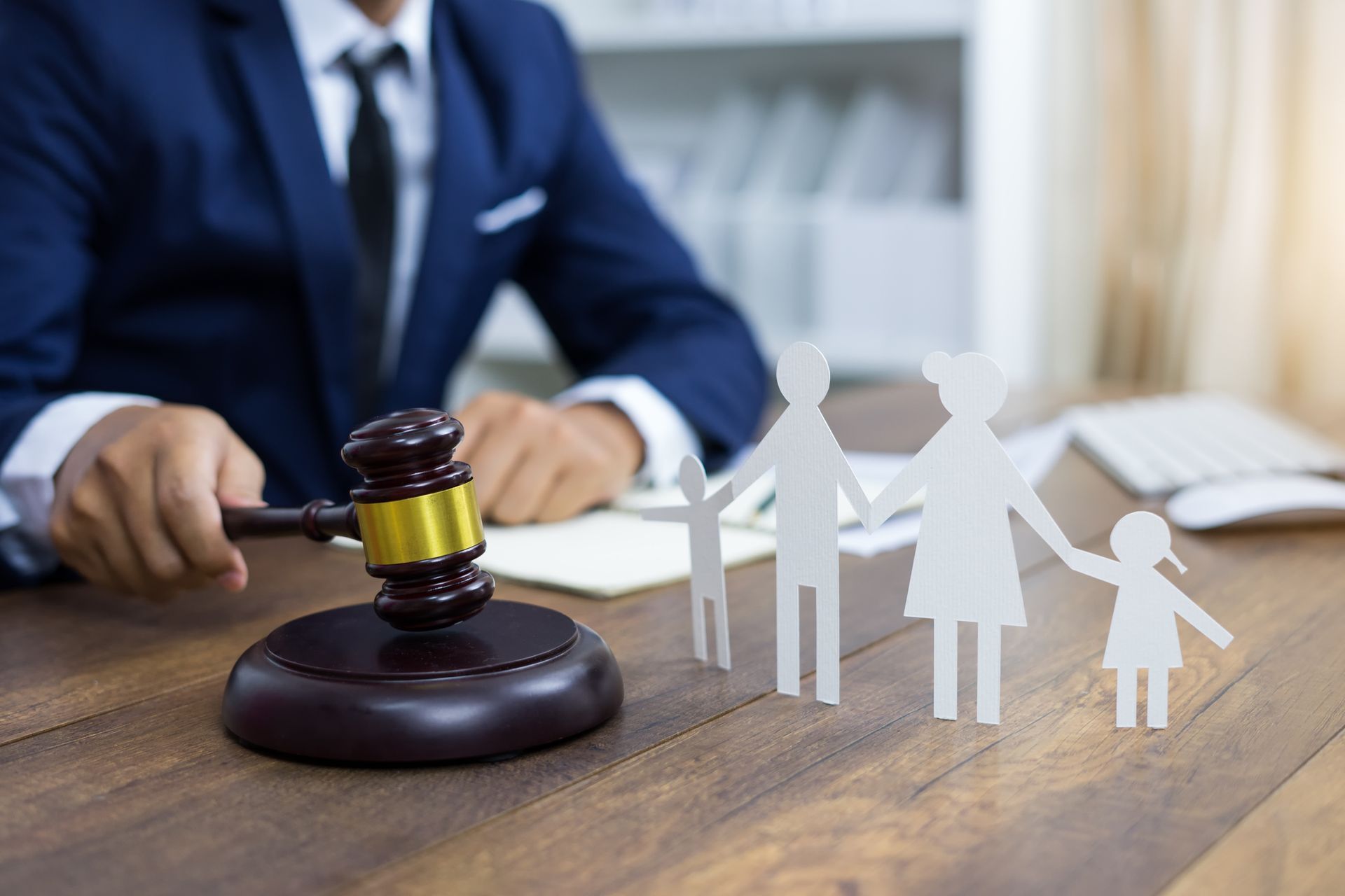 Family figure and gavel on table. Family law concept.