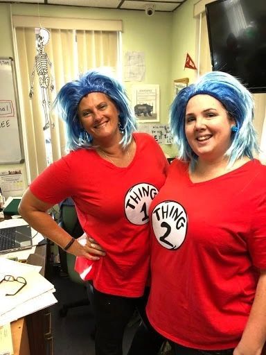 Two woman wearing blue wig and red shirt — Daytona Beach, FL — Monarch Academy