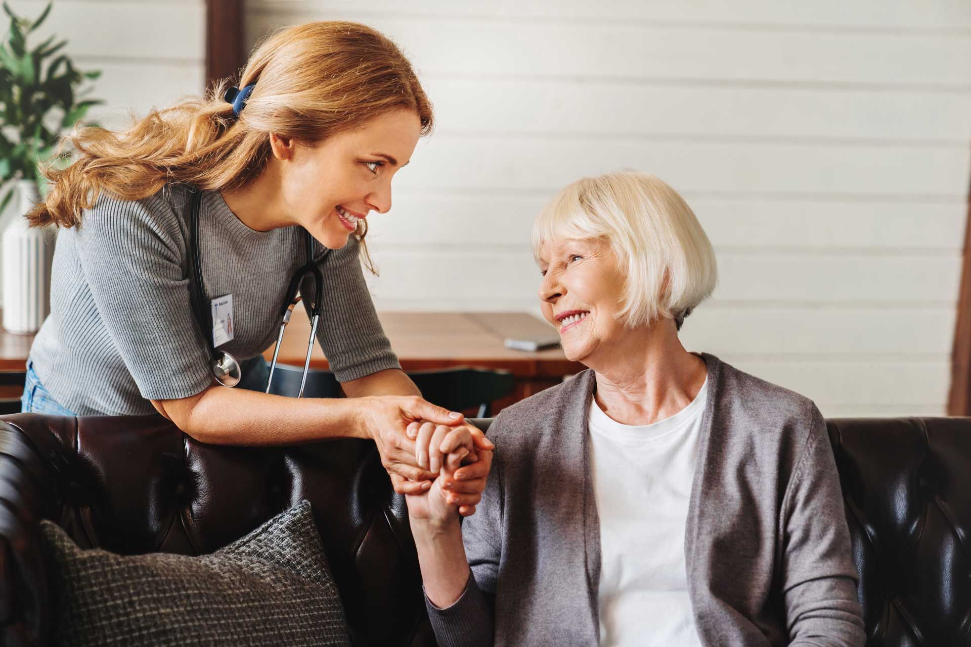 Person holding an old person's hand Person holding an old person's hand
