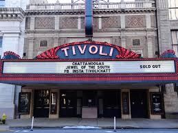 The front of a tivoli theater with a sold out sign.