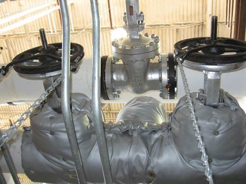 A close up of a valve with a chain around it