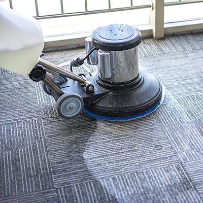 machine cleaning a carpet