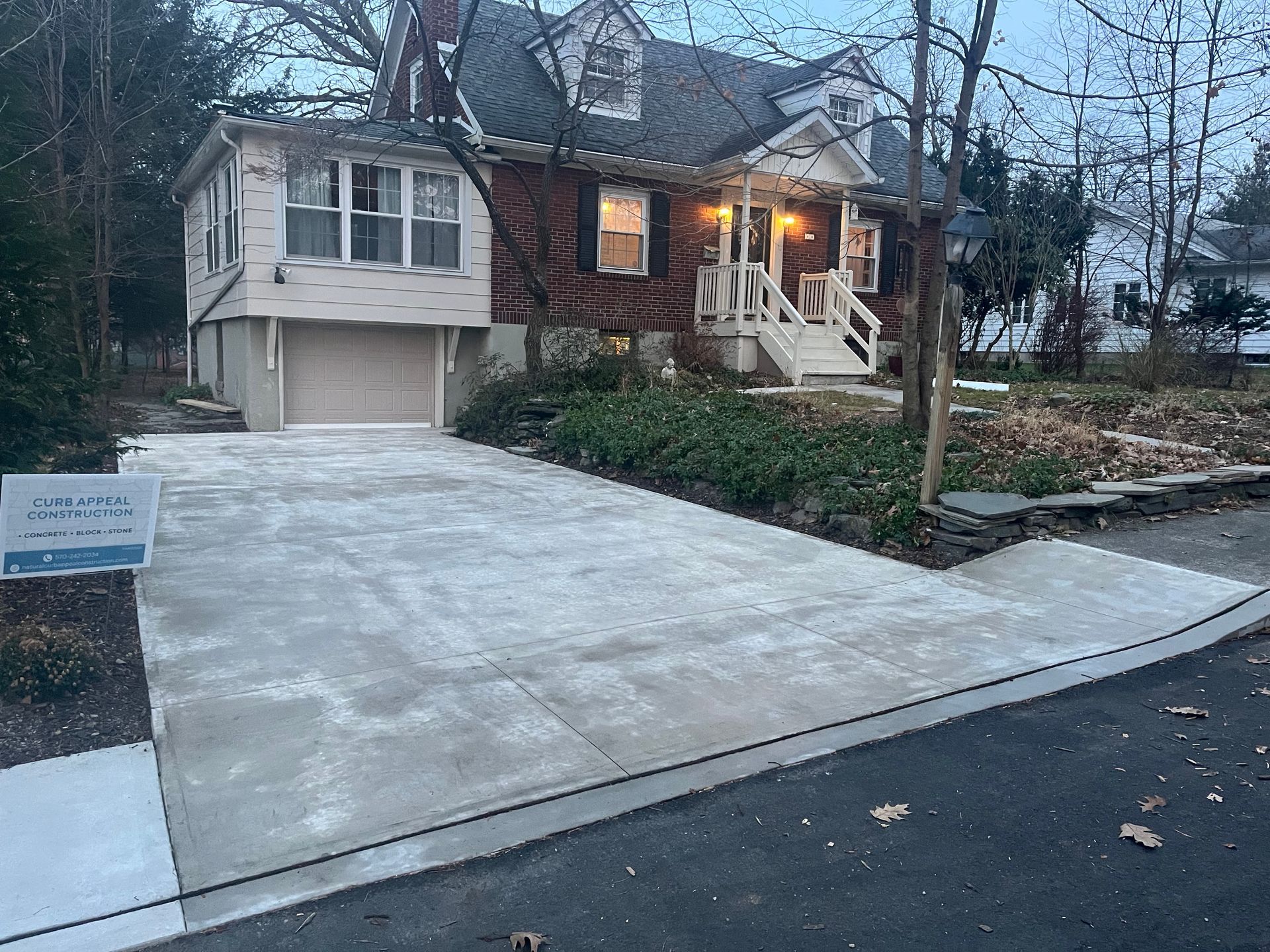 A group of people are working on a sidewalk.