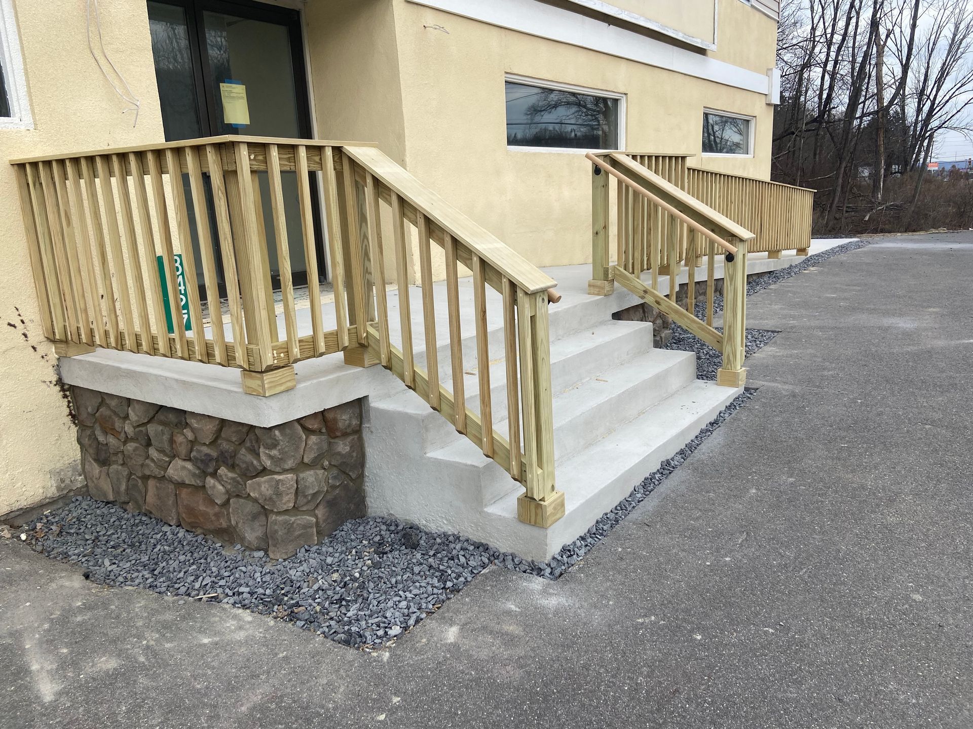 A building with stairs and a wooden railing