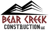 Logo for Bear Creek Construction featuring stylized mountain range over text.