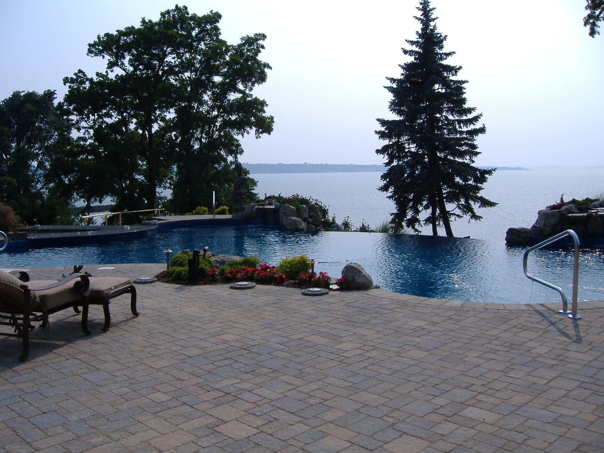 A large swimming pool with a view of the ocean