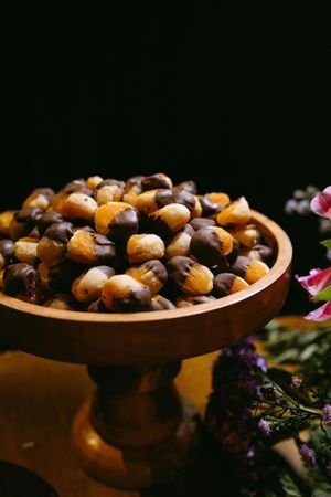 Family gathered at a dining table in a kitchen. They are eating and talking together.