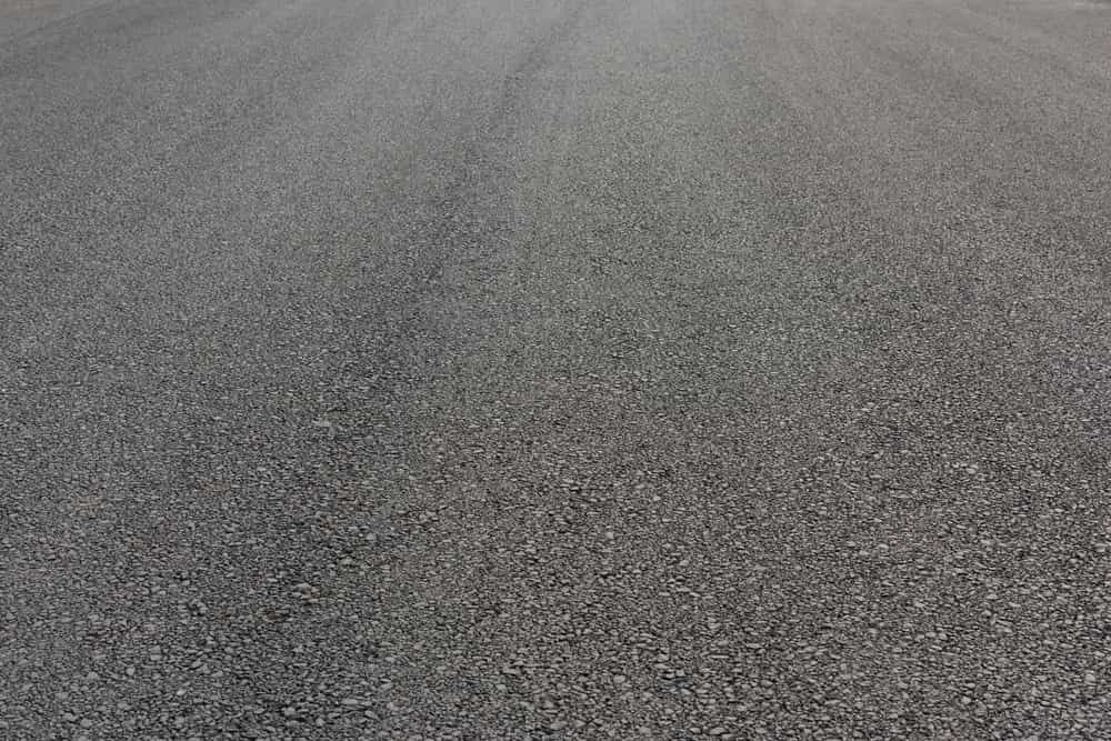 A Close Up Of A Gray Asphalt Driveway — Territory Bitumen Services In Tivendale, NT