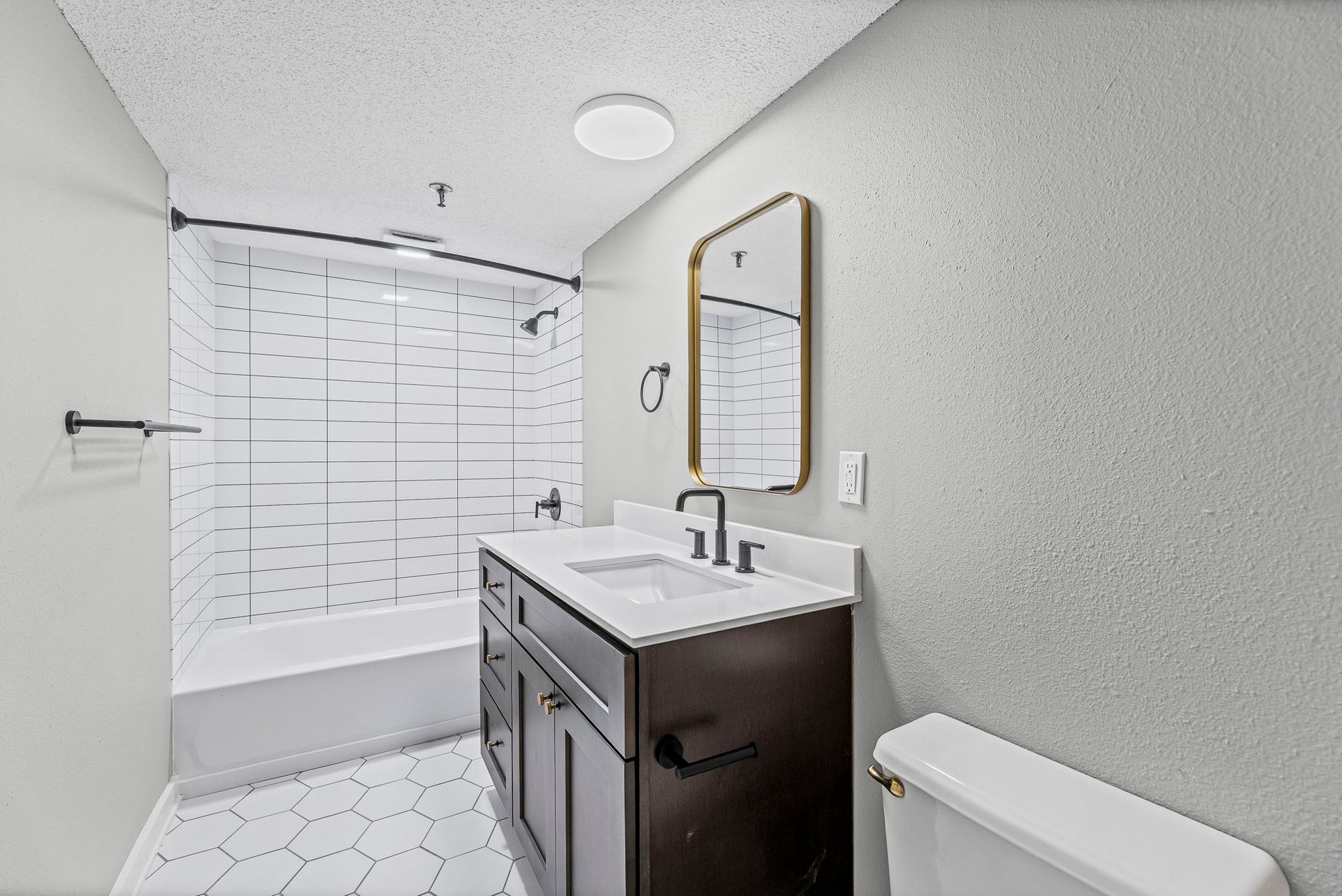 Renovated apartment bathroom with modern fixtures