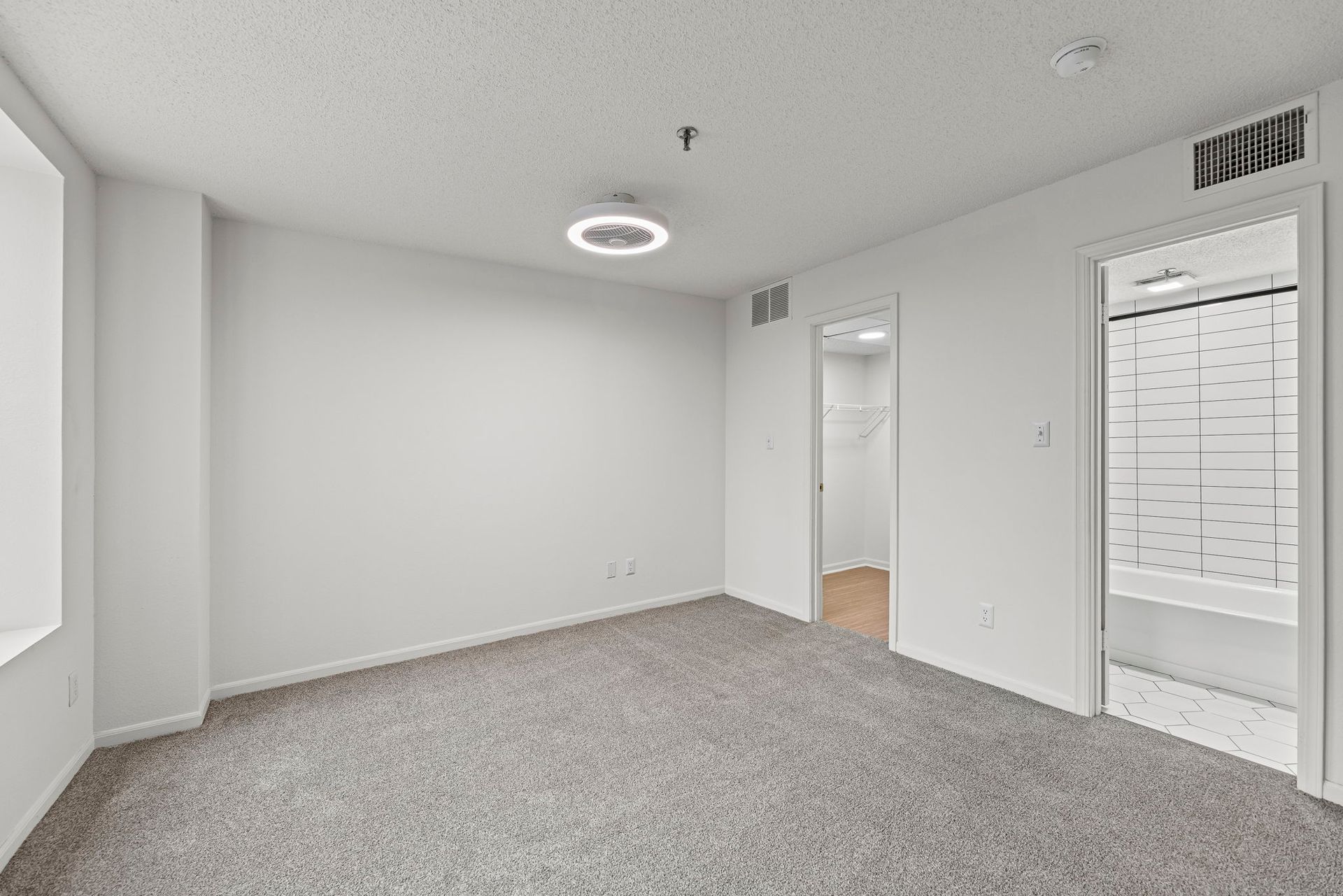 Renovated apartment showcasing modern flooring and finishes