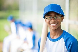teenager holding a baseball bat
