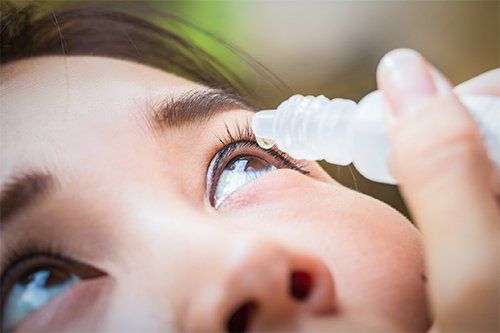 Woman Using Eye Drops