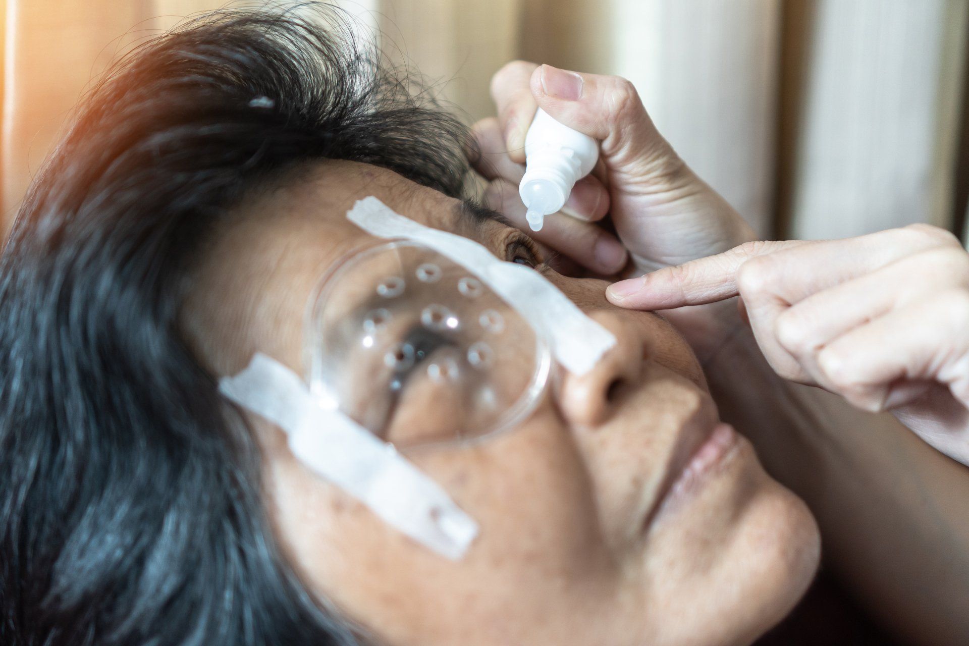 Elderly Patient Woman Having Eye Drop Care Treatment — Clarksville, TN — Calvert Ophthalmology Center