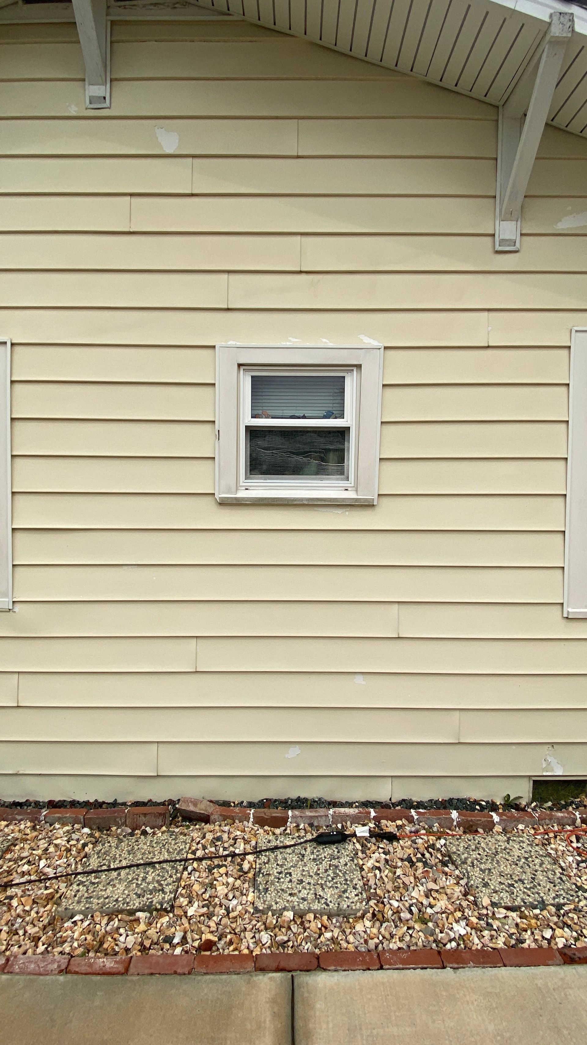 A house with a window on the side of it