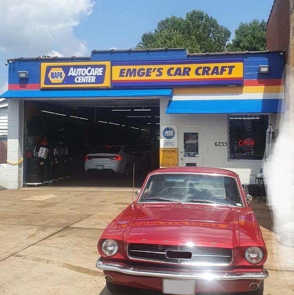 Red classic car parked in front of EMGE'S Car Craft, a NAPA AutoCare Center. | Emge's Car Craft Auto Services