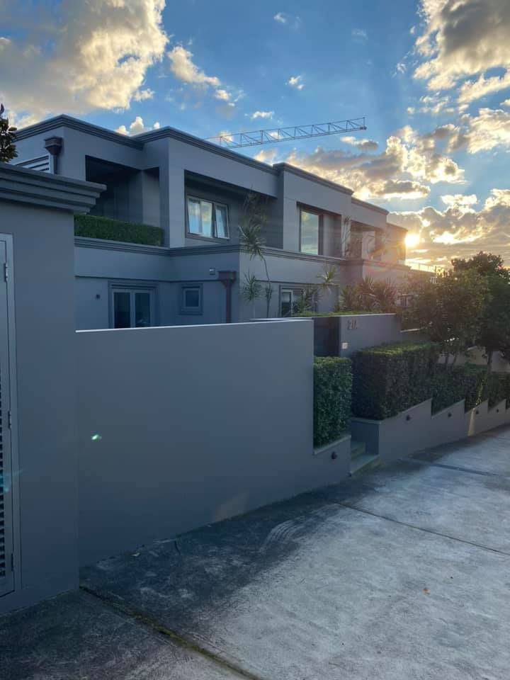 Modern Gray House With Hedges, Walls, and Sunny Sky — S D Maintenance In Kincumber, NSW