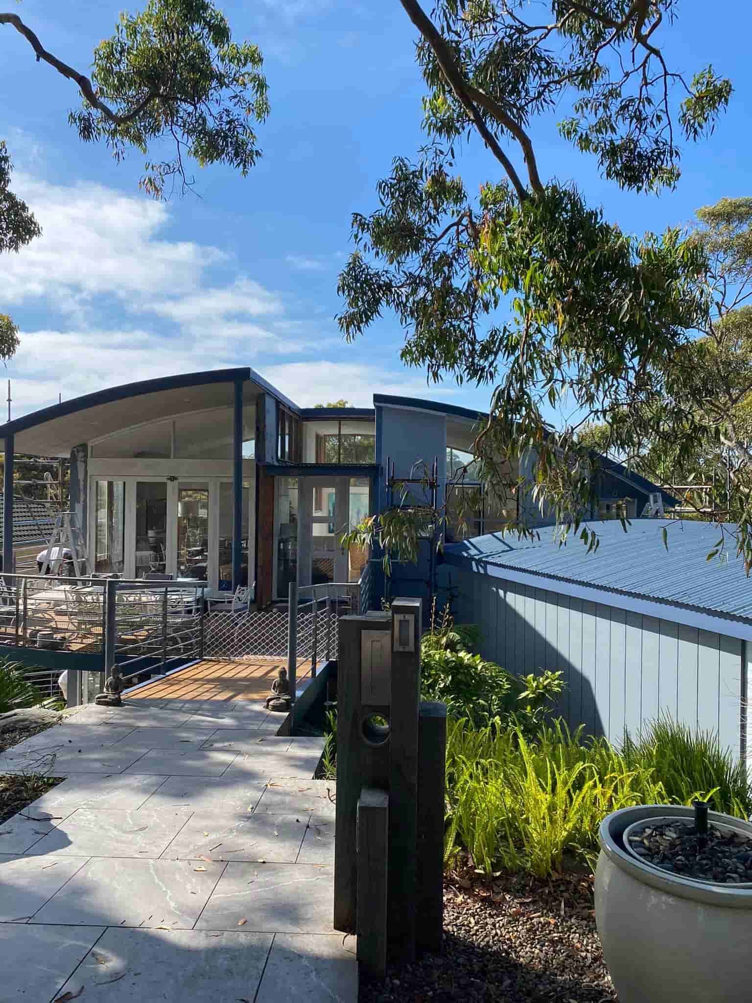 Modern House With Large Windows and Blue Accents — S D Maintenance In Kincumber, NSW