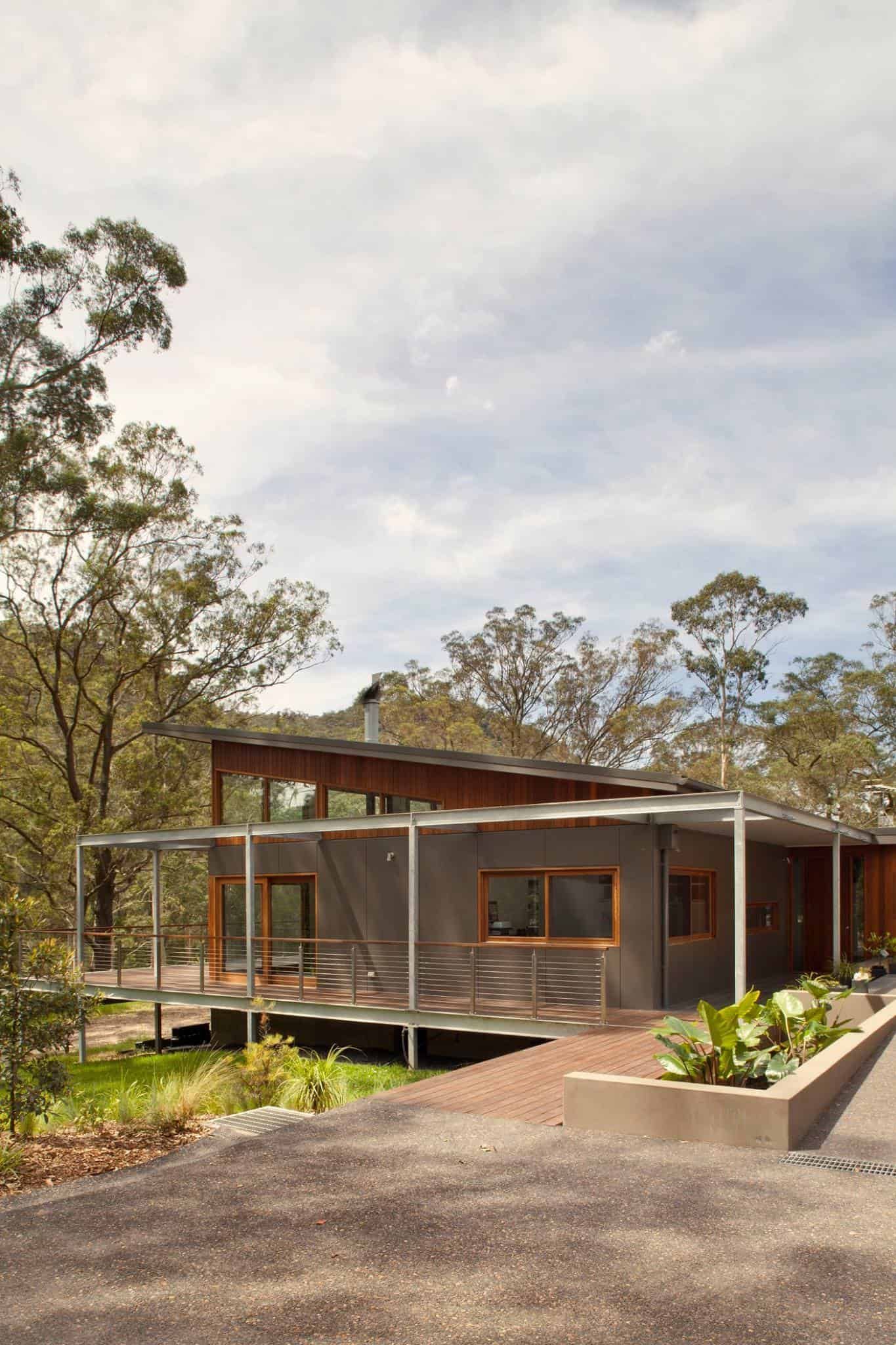 Modern House With a Corrugated Metal Facade Nestled in a Wooded Area — S D Maintenance In Point Clare, NSW