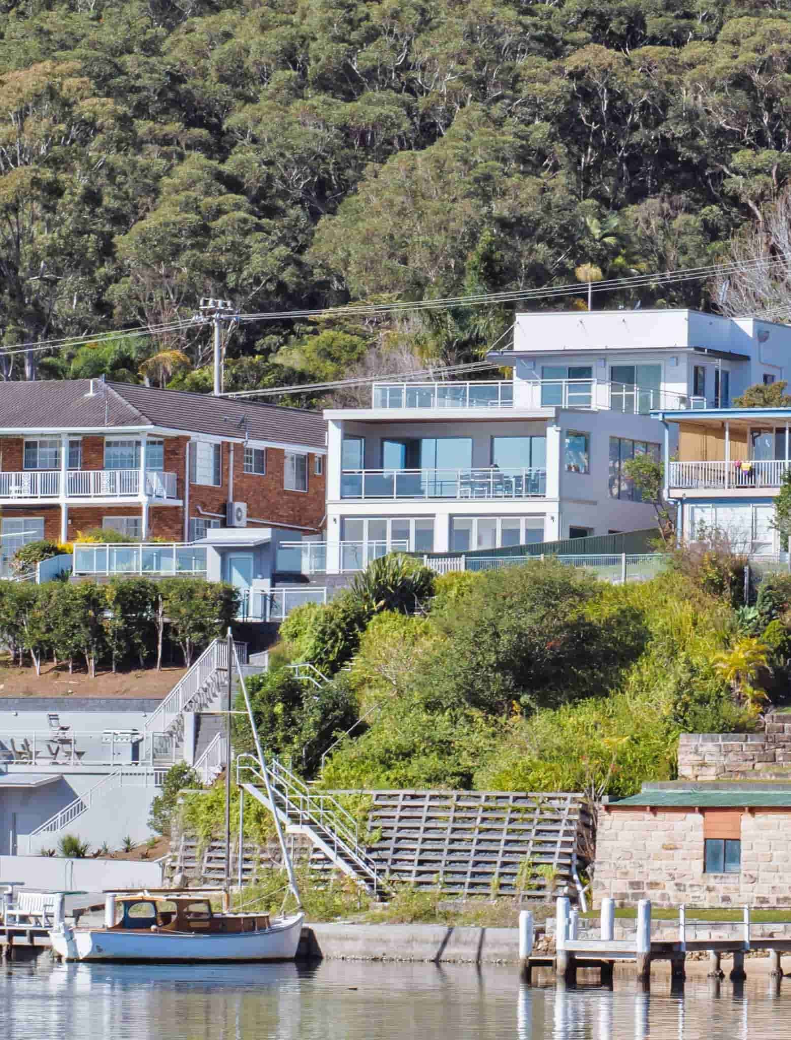 Houses on a Hillside Overlooking Water, With Greenery — S D Maintenance In Bateau Bay, NSW