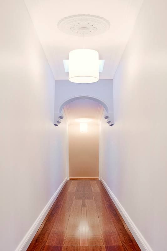 Narrow Hallway With Wooden Floor and Ornate Ceiling Lights — S D Maintenance In Point Clare, NSW