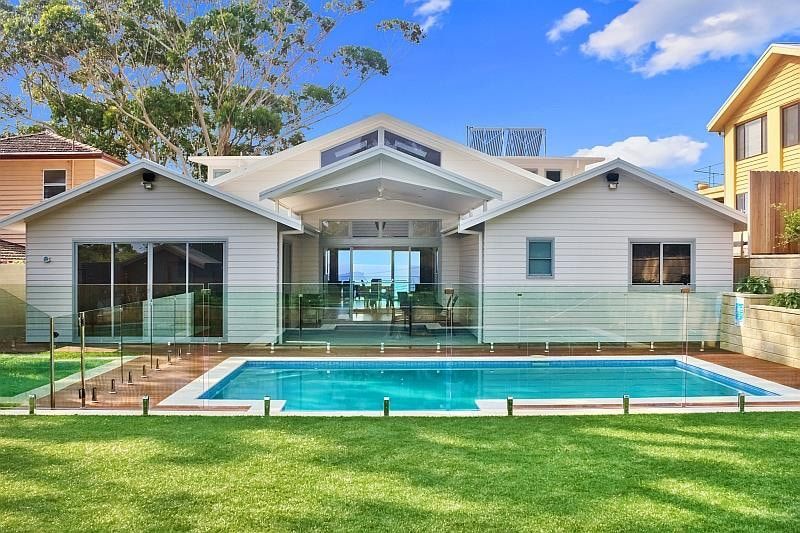 White Beach House With a Pool, Glass Fence, and Ocean View — S D Maintenance In Terrigal, NSW