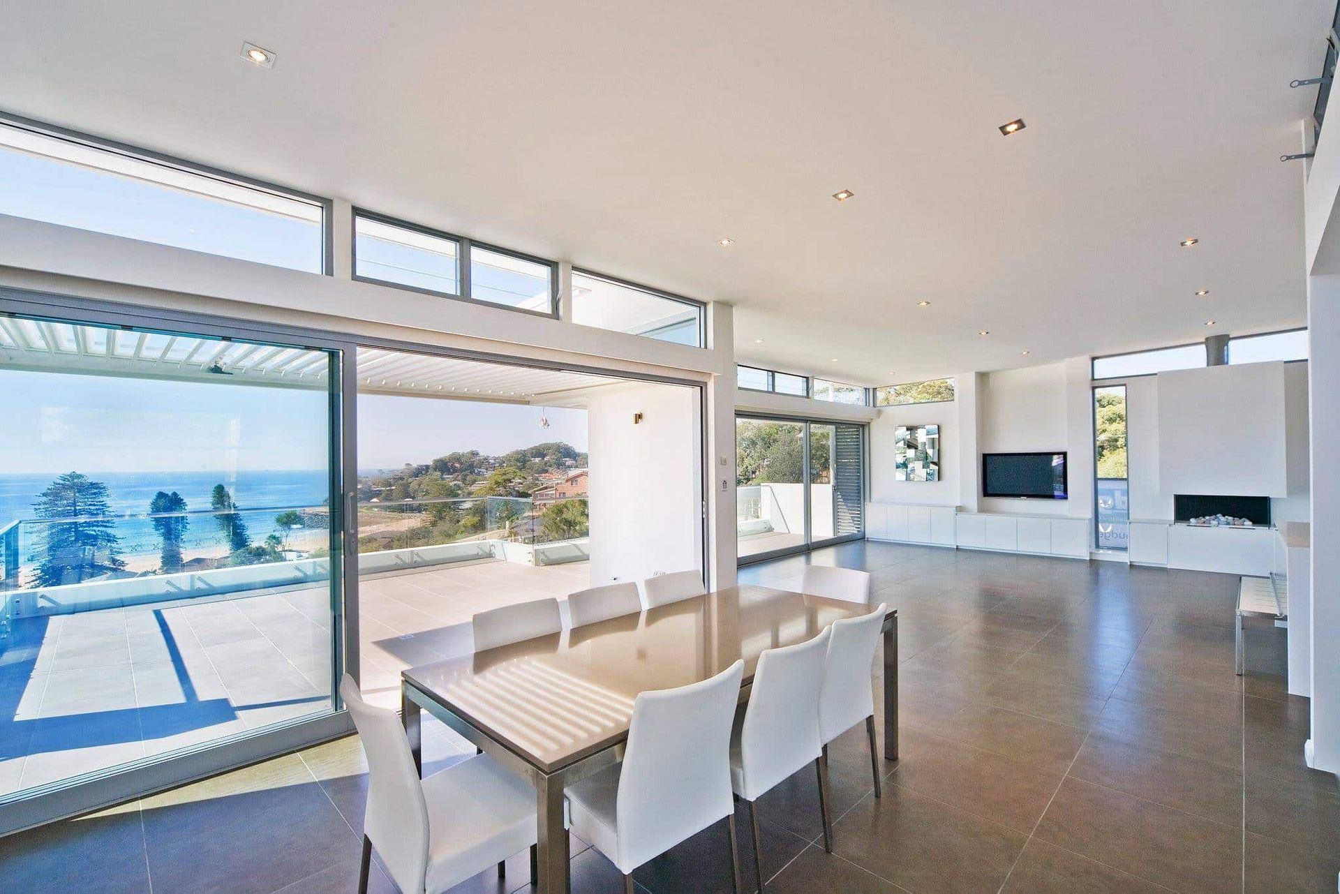 Bright, Modern Dining Room With Ocean View and Large Windows — S D Maintenance In Avoca, NSW