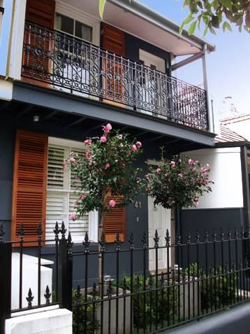 Two-Story House With Black Exterior, Balcony, Ornate Iron Fence — S D Maintenance In Erina, NSW