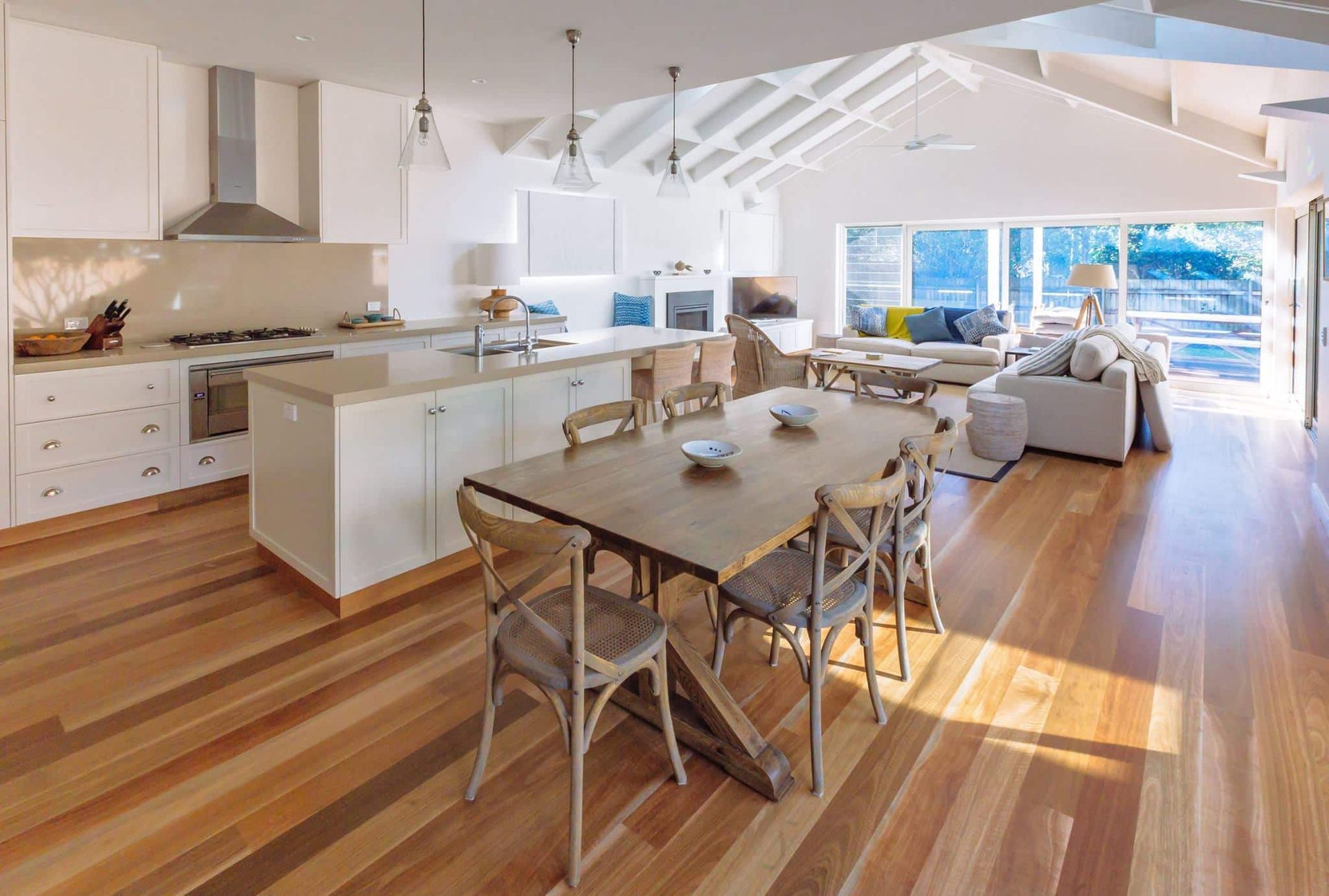 Bright, Open-plan Kitchen and Living Space With Wooden Floors — S D Maintenance In Erina, NSW