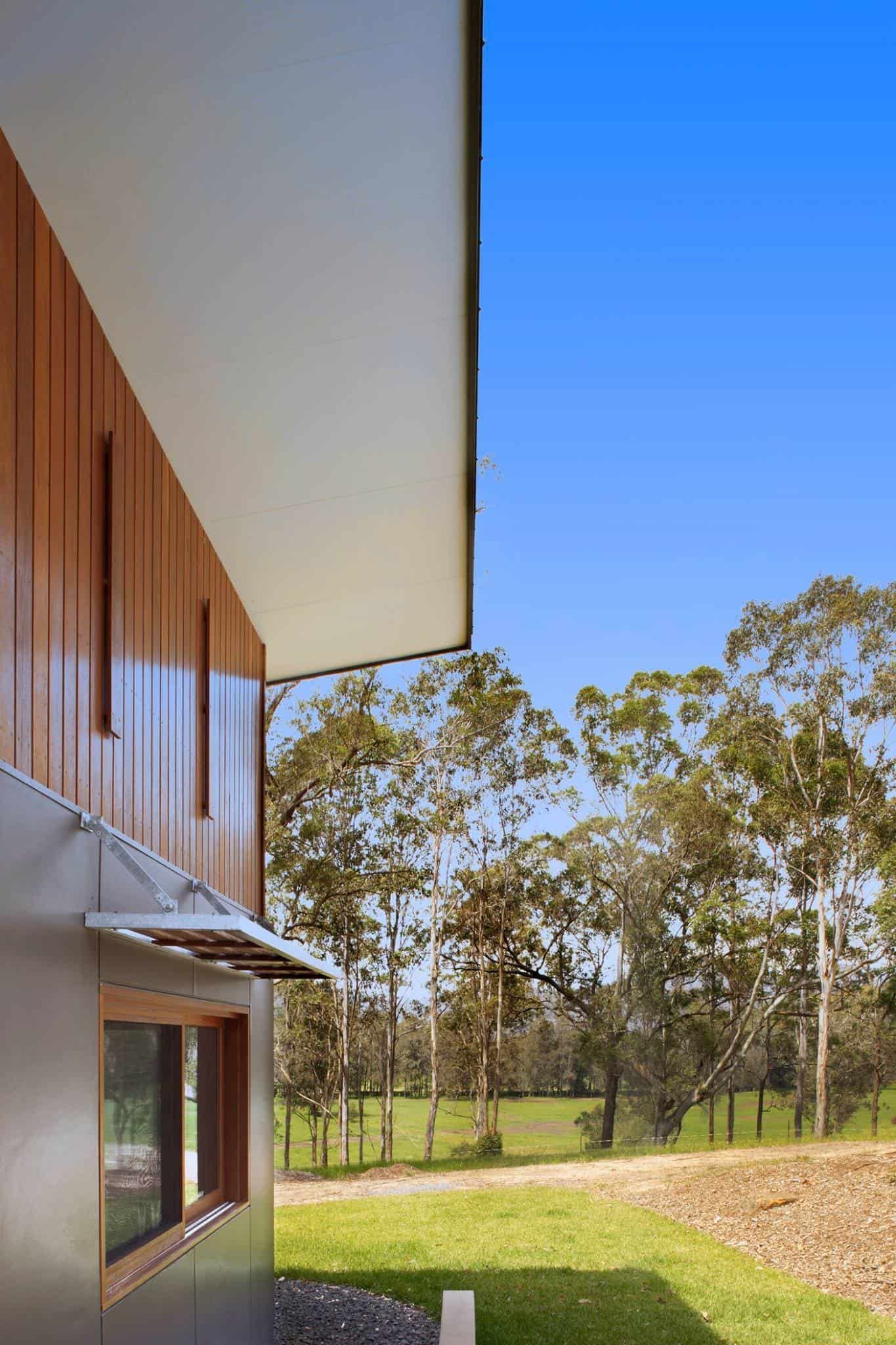 Side View of a Modern Building With Brown Wooden Siding — S D Maintenance In Avoca, NSW