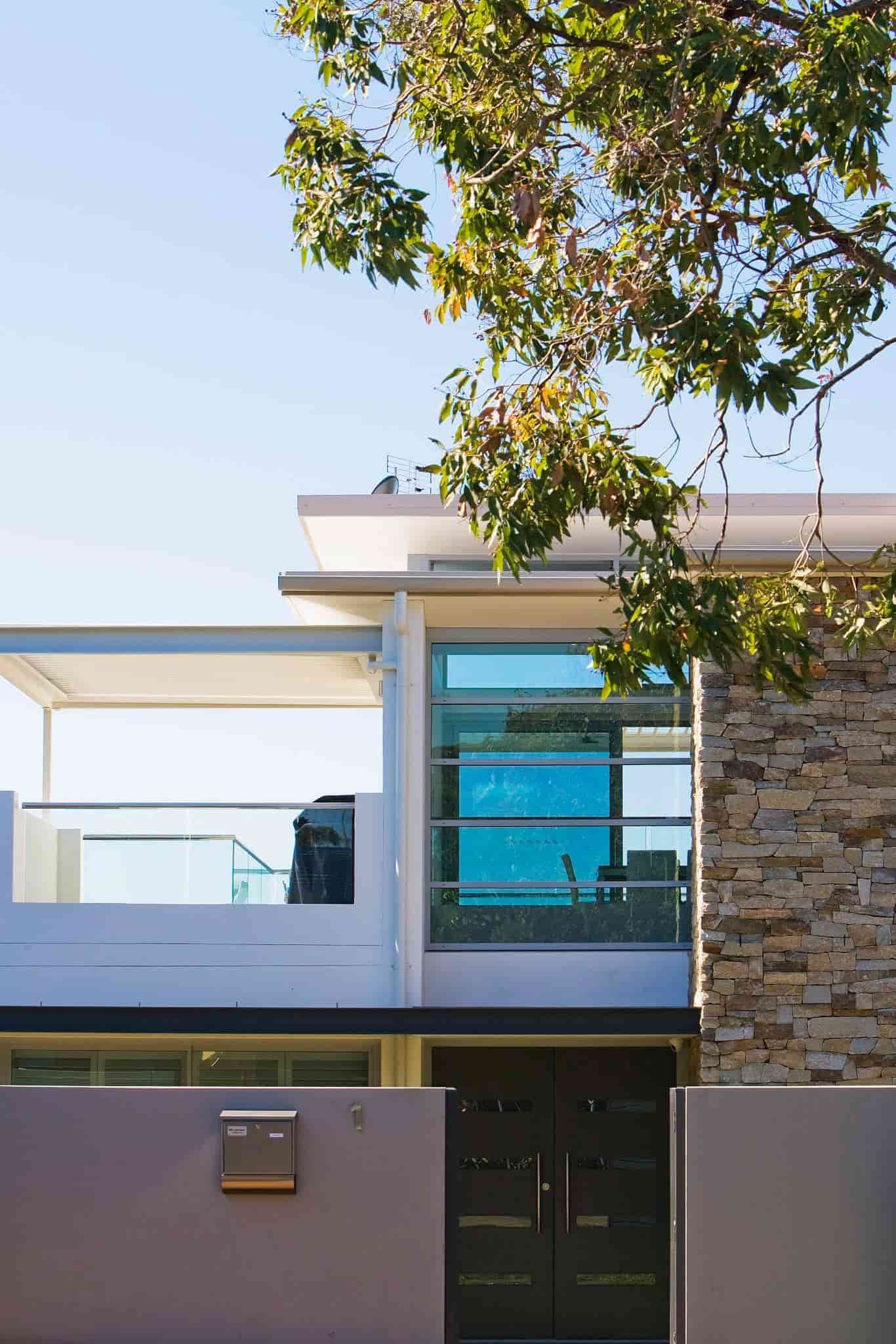 Modern Two-story House With a Stone Accent, Balcony, and Large Window — S D Maintenance In Gosford, NSW