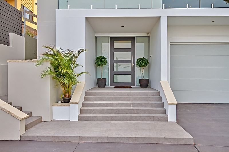 White House With Gray Steps Leading to a Glass Front Doo — S D Maintenance In Bateau Bay, NSW