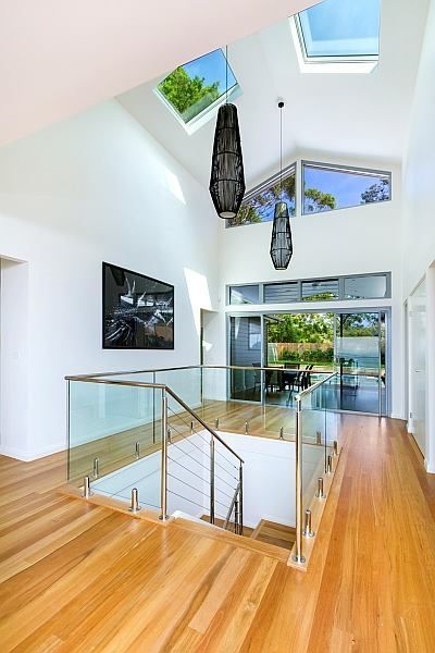 Bright Interior With Wood Floors, Glass Railings, Skylights, and Outdoor View โ S D Maintenance In Point Clare, NSW