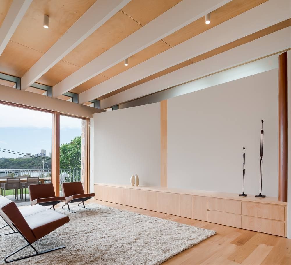 Modern Living Room With Wood Beams, Built-in Cabinetry, and Large Windows — S D Maintenance In Point Clare, NSW