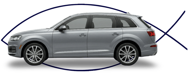 Blue car-shaped keychains displayed on the front desk, with a BMW mug and a Christian fish symbol sign in the background.