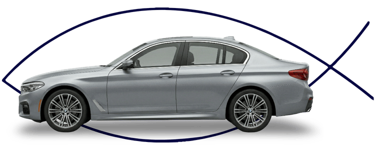 Blue car-shaped keychains displayed on the front desk, with a BMW mug and a Christian fish symbol sign in the background.