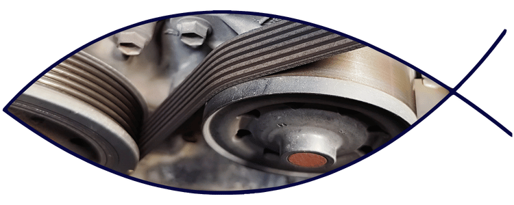 Blue car-shaped keychains displayed on the front desk, with a BMW mug and a Christian fish symbol sign in the background.