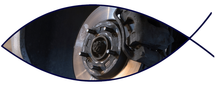 Brake rotor and caliper close-up during inspection