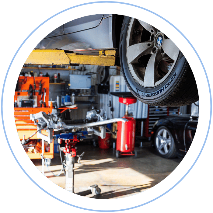 Drivetrain inspection with vehicle lifted in shop