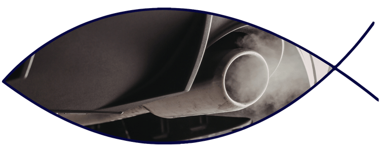 Blue car-shaped keychains displayed on the front desk, with a BMW mug and a Christian fish symbol sign in the background.