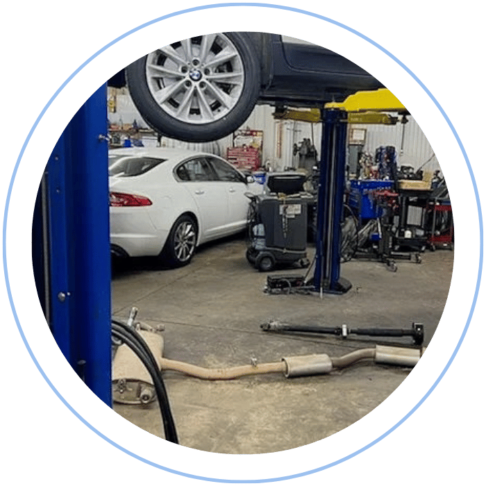 Exhaust system repair with vehicle elevated