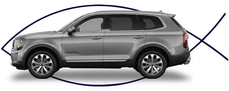 Blue car-shaped keychains displayed on the front desk, with a BMW mug and a Christian fish symbol sign in the background.